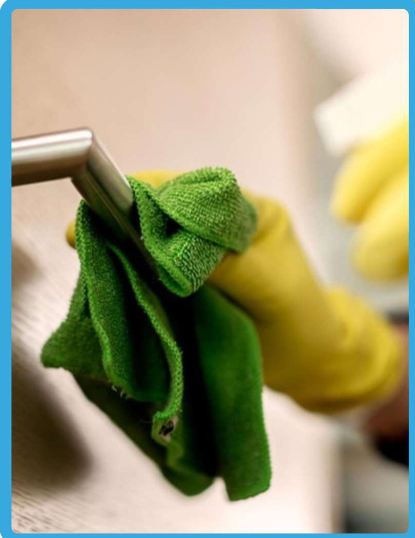 Trained cleaning professional performing hygienic surface sanitization with modern equipment